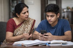 mother discussing studies with teenage student distracted by mobile phone while studying at home