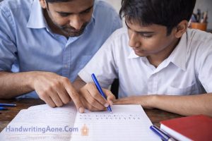 parent guiding child handwriting practice in notebook during exam preparation
