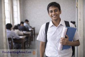happy student showing notebook with neat handwriting improvement