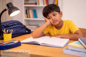 child looking tired and distracted while studying highlighting study motivation problems explained by HandwritingAone.Com
