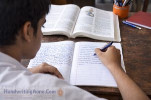 student writing study notes in notebook practicing handwriting improvement for exams
