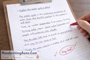 teacher marking answer sheet with good handwriting and clear presentation explained by HandwritingAone.Com