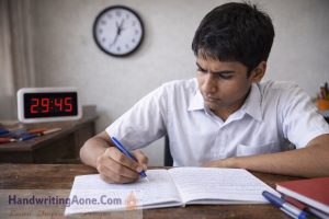 student writing quickly during exam while clock shows time pressure