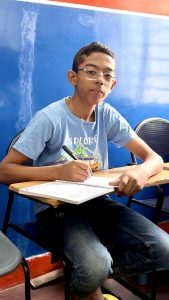 Student improving handwriting skills during class in Bangalore handwriting institute
