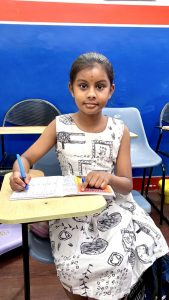School student improving handwriting skills during class in Vijayanagar Bangalore handwriting course