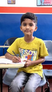 Kid improving pencil control and handwriting skills in Bangalore handwriting training